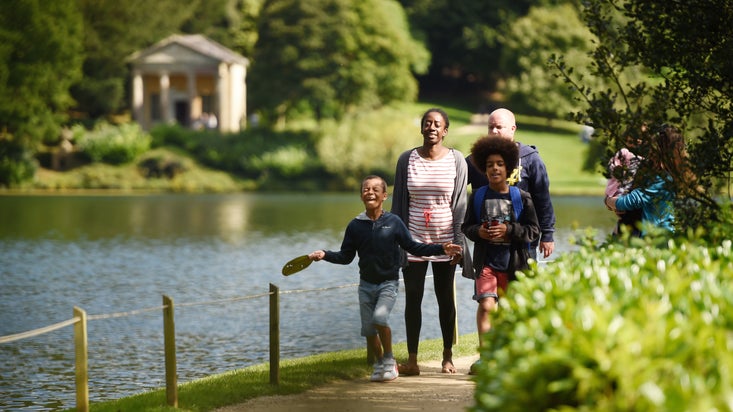 Family exploring the garden at Stourhead, Wiltshire